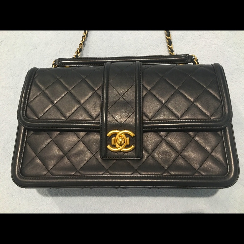 Authentic Chanel classic jumbo black lambskin leather handbag.